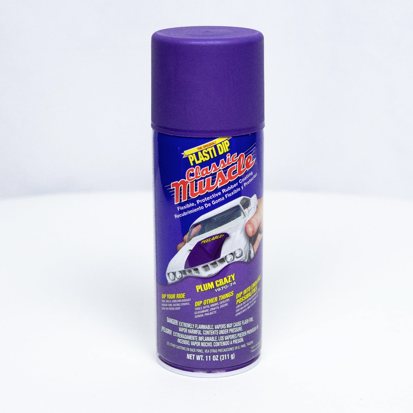 Can of purple "plum crazy" aerosol Plasti Dip on white background